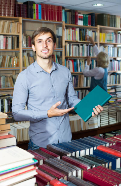 istock man holding book in hard 640270484