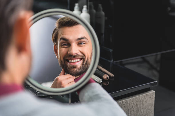 istock Happy man likes his hairstyle 640272110