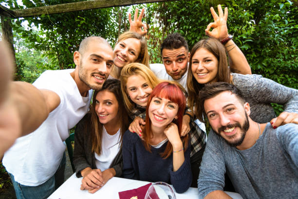 istock taking a selfie during the lunch with bizzarre gesturing 640273206