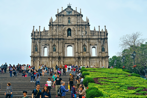 Macao, China - March 8, 2016: Ruins of Saint Paul in Historic old city center in Macao, China. People on the background