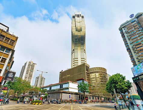 Macao, China - March 8, 2016: Square with skyscrapers in Macao, China. People on the background