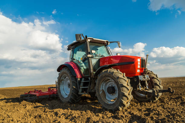 istock Farmer in tractor preparing land with seedbed cultivator. 640280494