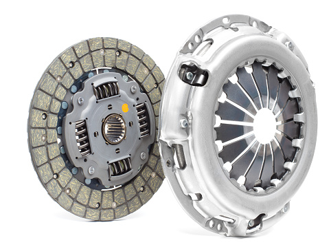 A new set of replacement automotive clutch on a white background. Disc and clutch basket with release bearingA new set of replacement automotive clutch on a white background. Disc and clutch basket with release bearing