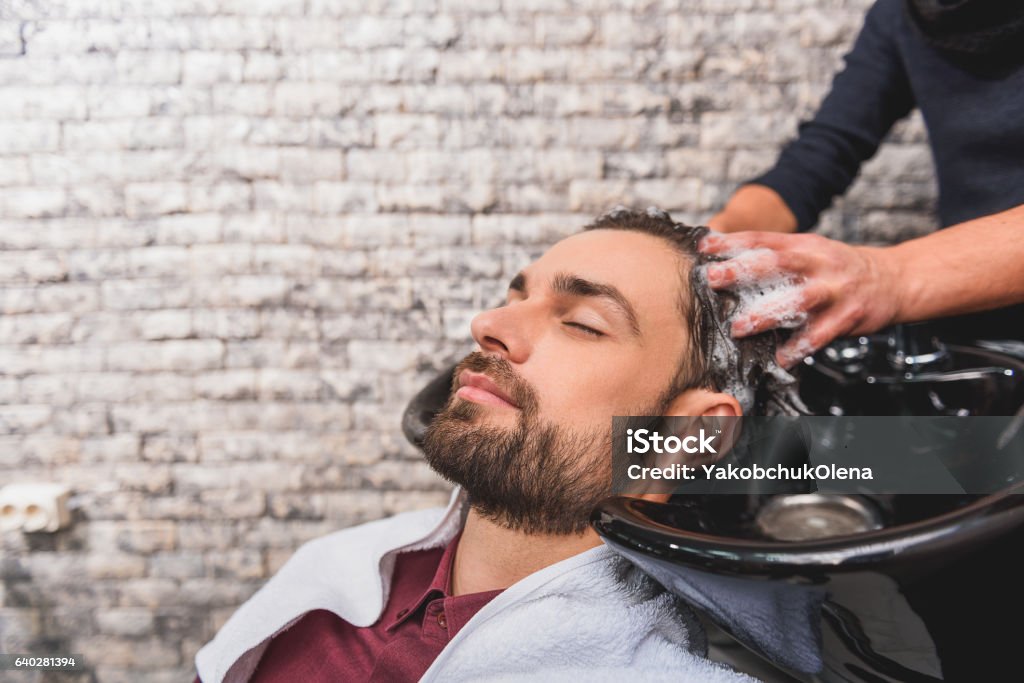 Young Man Enjoying Hairwash At Beauty Salon Stock Photo - Download Image  Now - Men, Hair Salon, Hairstyle - iStock