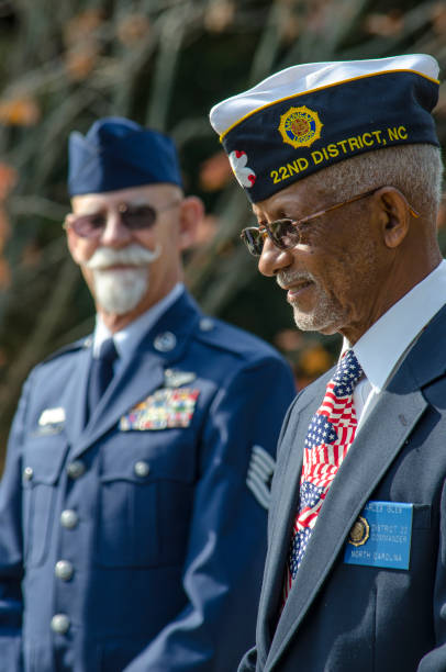 American Veterans Honored at a Veteran’s Day Cermony Belmont, North Carolina, USA - November 11, 2016: United States Veterans of foreign wars were honored at a Veteran’s Day ceremony in Belmont, North Carolina to those who served and currently serve in the armed forces. The ceremony was proud to honor Veteran’s from World War II, The Korean War, The Vietnam War and those who serve and have served in the Middle East and Afghanistan. air force salute stock pictures, royalty-free photos & images