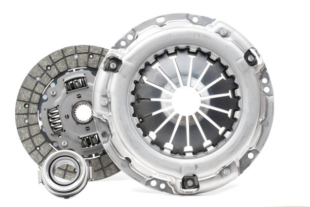 Disc and clutch basket with release bearing A new set of replacement automotive clutch on a white background. Disc and clutch basket with release bearing coupling stock pictures, royalty-free photos & images