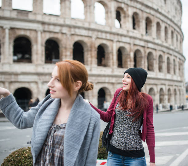 istock friends woman walking embraced in rome 640281904