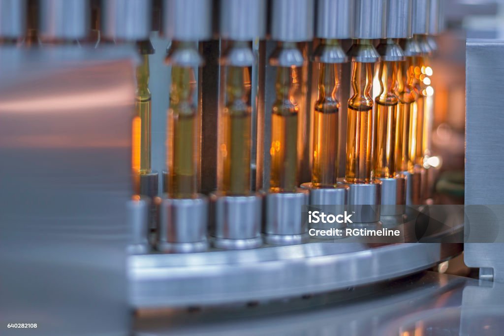 Pharmaceutical Optical Ampule/ Vial Inspection Machine Inspects vials and ampules for particulates in liquid and container defects. Pharmaceutical automatic inspection machine. Vial Stock Photo