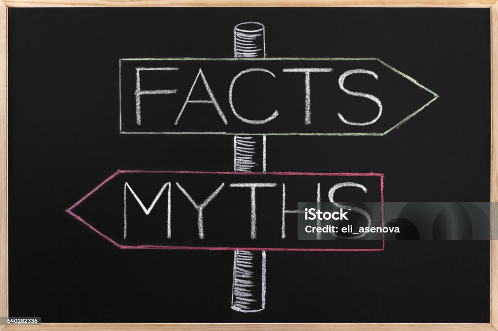 Choicе Myths or Facts wrriten on opposite arrows on Blackboard Choicе between Myths or Facts wrriten on opposite arrows on Blackboard Mythology Stock Photo