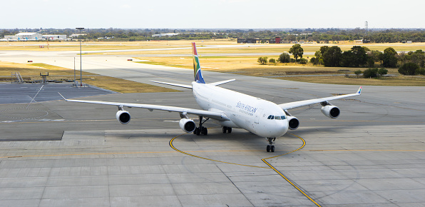 Perth, Australia - November 12, 2016: South African Airways Airbus A340 taxies on Perth airport in an Olympics color scheme, on November 12 2016 in Perth, Australia.
