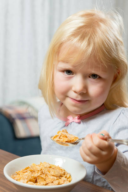 istock Young girl eating breakfast 640282930