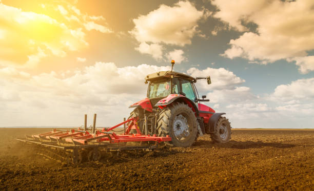 istock Farmer in tractor preparing land with seedbed cultivator. 640284732