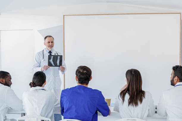 istock Senior doctor teaching interns at clinic 640285728