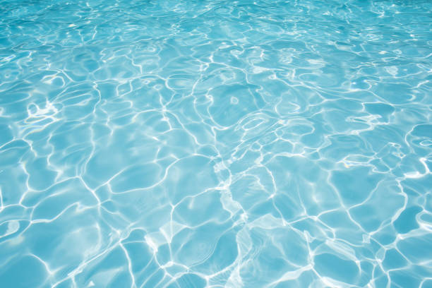 istock Blue water surface in swimming pool with sun reflection 640286502