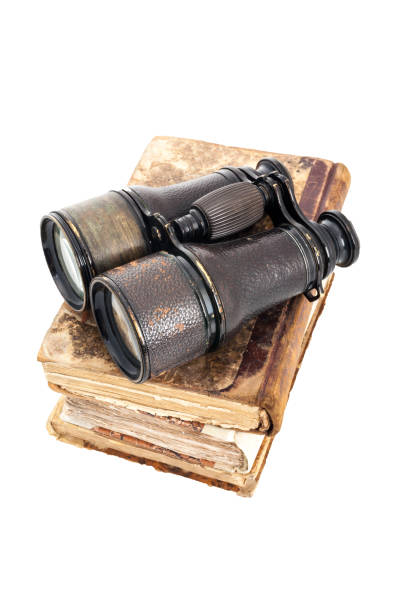 istock fileld glasses over a stack of ancient books 640286534