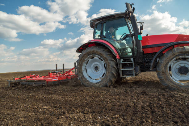 istock Farmer cultivating arable land before seeding 640287556