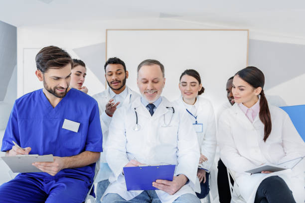 istock Senior physician making medical explanation for colleagues 640287586