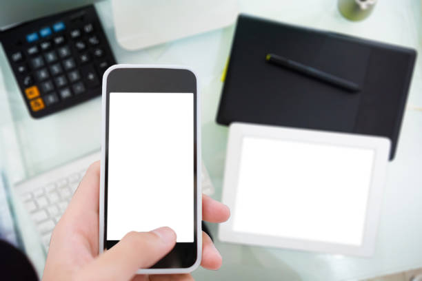 Business Using a smart phone and digital tablet analysis stock market