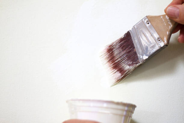 istock Hand with Paint Brush Wet with White Paint, Paint Cup 640289288