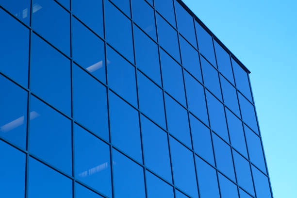 istock blue skyscraper office tower glass mirror windows and sky 640292294