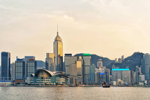 istock Small Junk and Victoria Harbor in Hong Kong 640294064