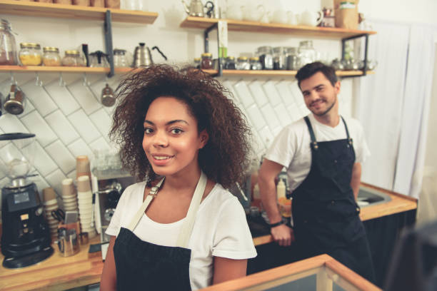 istock Two smiling baristas working at cafeteria 640295008