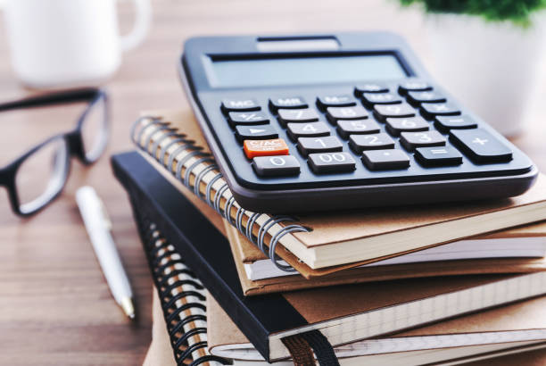 istock Office desk with calculator 640300536