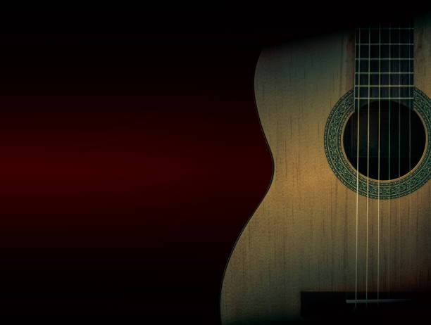 istock Part of a orange acoustic guitar on black background. 640302222
