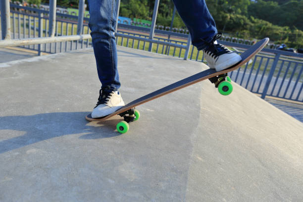 istock young skateboarder legs riding skateboard at skatepark 640302294