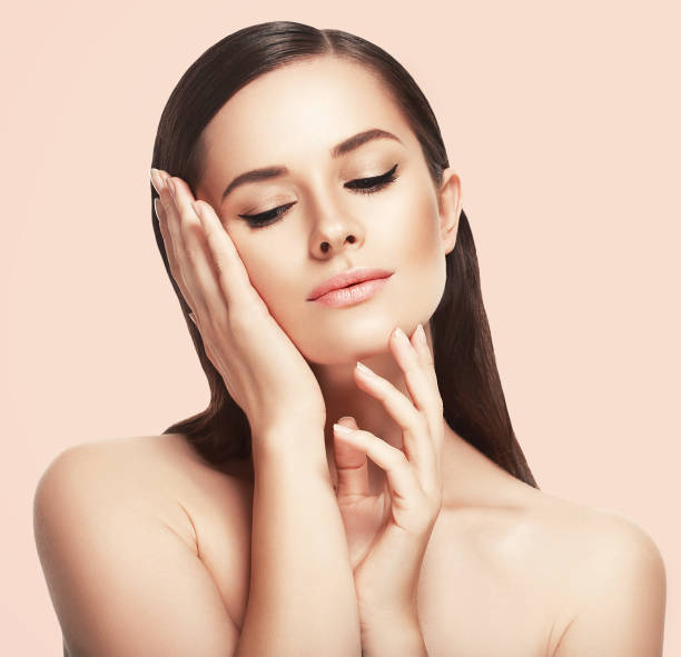 istock Beautiful woman face close up studio on pink 640302312
