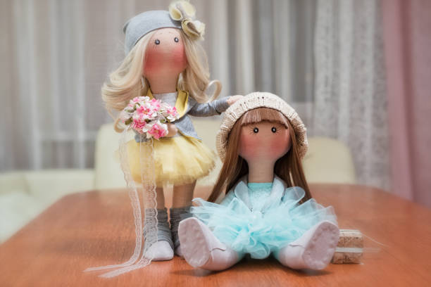 istock Two handmade rag dolls - blonde and brown-haired 640304560