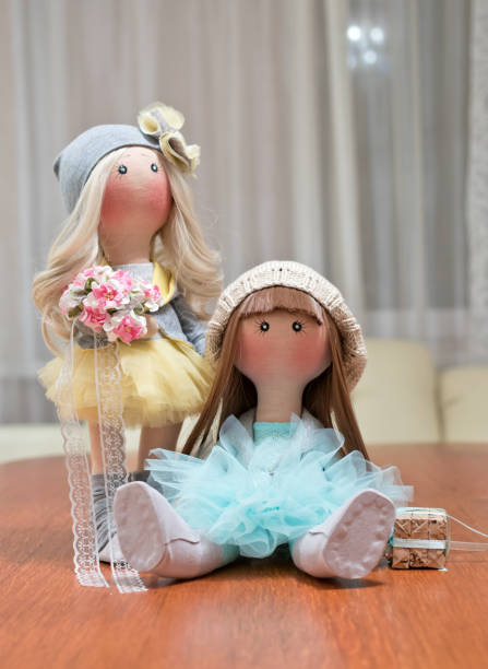 istock Two handmade rag dolls - blonde and brown-haired 640304596
