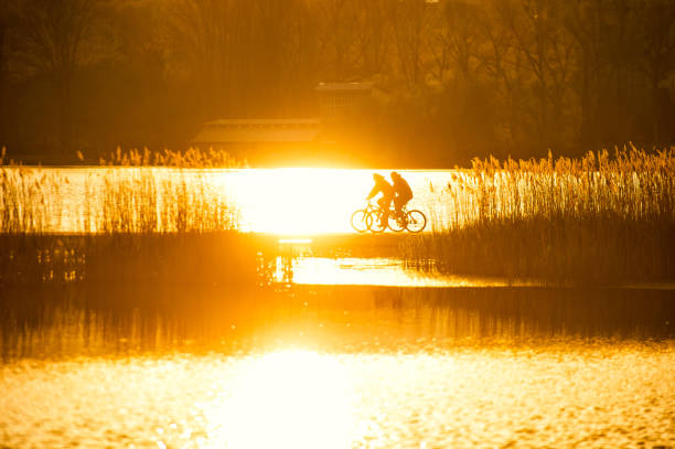 silhouette of biker on Bridge stock photo