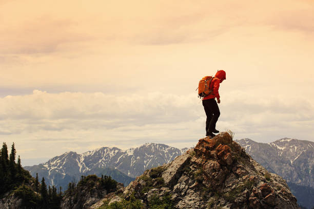 istock successful woman backpacker enjoy the view on mountain peak 640306506