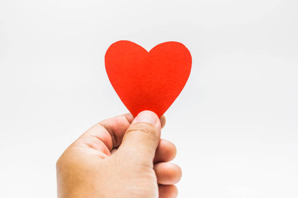 istock Man holding a red heart shape in his hands. 640306526