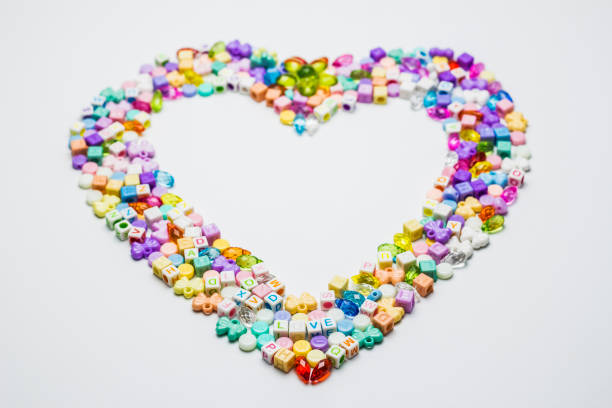 istock Colorful of beads with heart shape on white background. 640306698