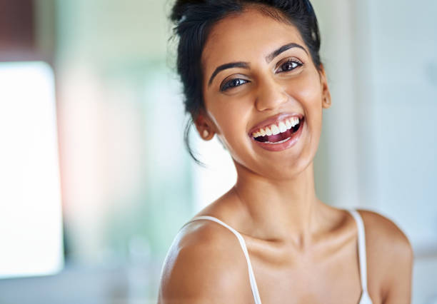 I feel absolutely fabulous Portrait of an attractive young woman going through her morning routine indian woman laughing stock pictures, royalty-free photos & images