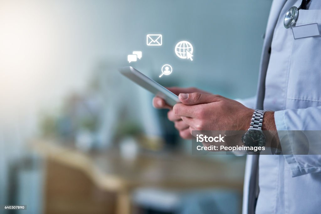 On call, online Cropped shot of a doctor receiving notifications on a digital tablet Healthcare And Medicine Stock Photo