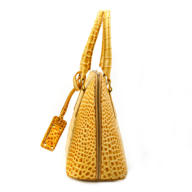 istock Elegant  Yellow   leather woman's handbag isolated on white background 640310390