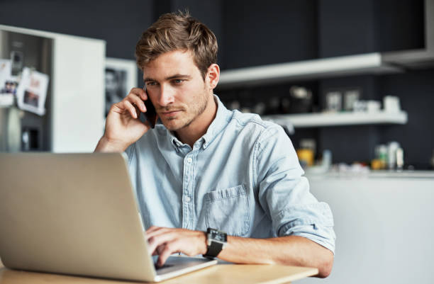 Working from the comfort of his kitchen