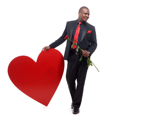 istock African man holding present to Valentine Day. 640313350