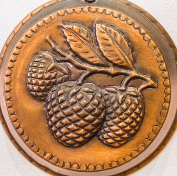 Decoration on the bottom of a vintage pudding mold made of copper.