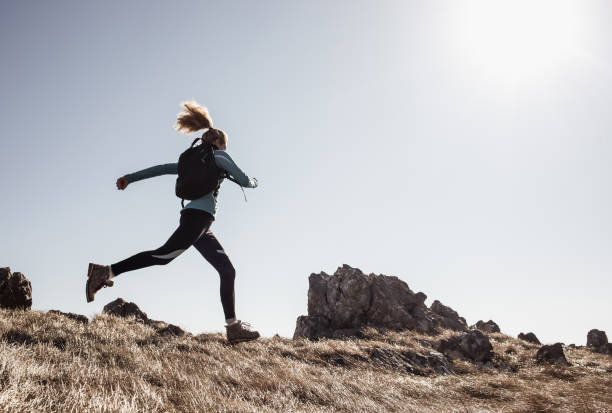 istock Female Hiker Running Across a Hill 640317716