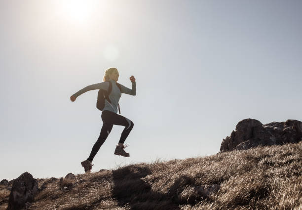 istock Female Hiker Running Across a Hill 640317720