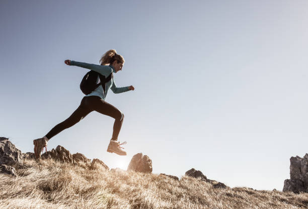 istock Female Hiker Running Across a Hill 640317738