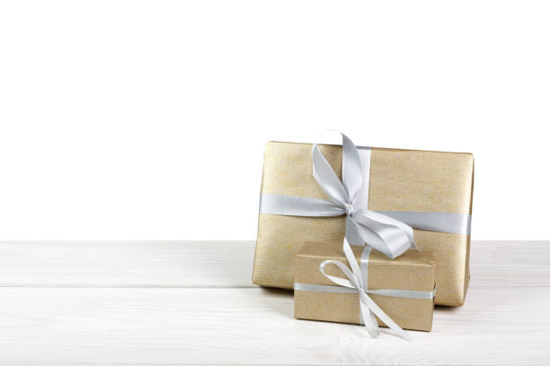 istock Christmas holiday gift boxes wrapped in paper isolated on white 640321004