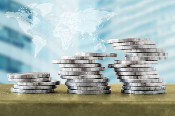 istock Coin stacks and digital network line with world map, cityscape 640322452