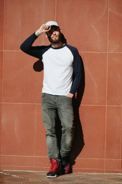 istock hipster wearing white blank t-shirt with space for your logo 640323218