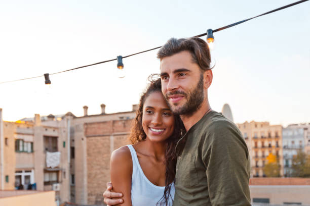 istock Happy young couple at the rooftop party 640323878