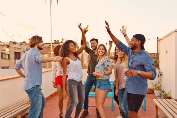 istock Multi ethnic friends dancing at the rooftop party 640324392